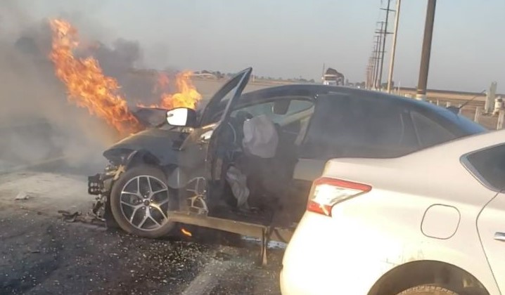 A burning car and another one from a head-on crash.