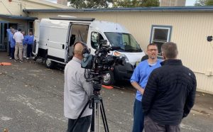 Behind the scenes at Folsom prison with Office of Public and Employee Communications (OPEC). Photo shows a camera man, interviewer and an incarcerated interviewee.