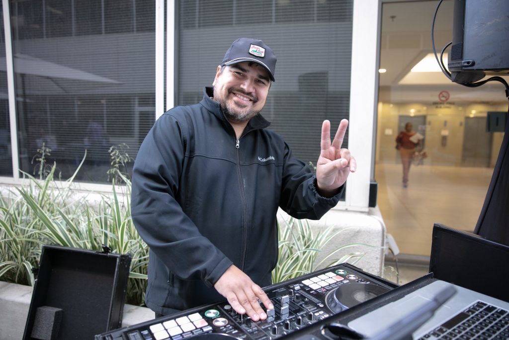 A DJ working a mixing table.
