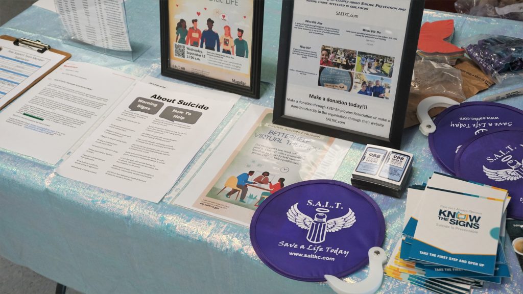 A table with information and handouts on suicide prevention.