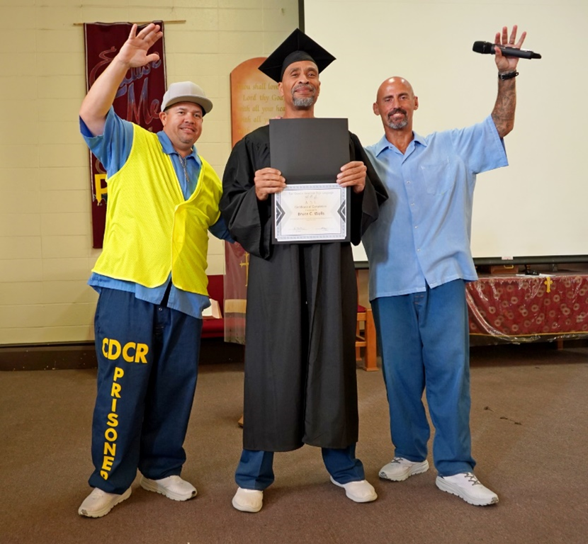 incarcerated in cap and gown at SQ ASL graduation