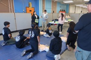 children practicing CPR at CAL Junior Correctional Academy