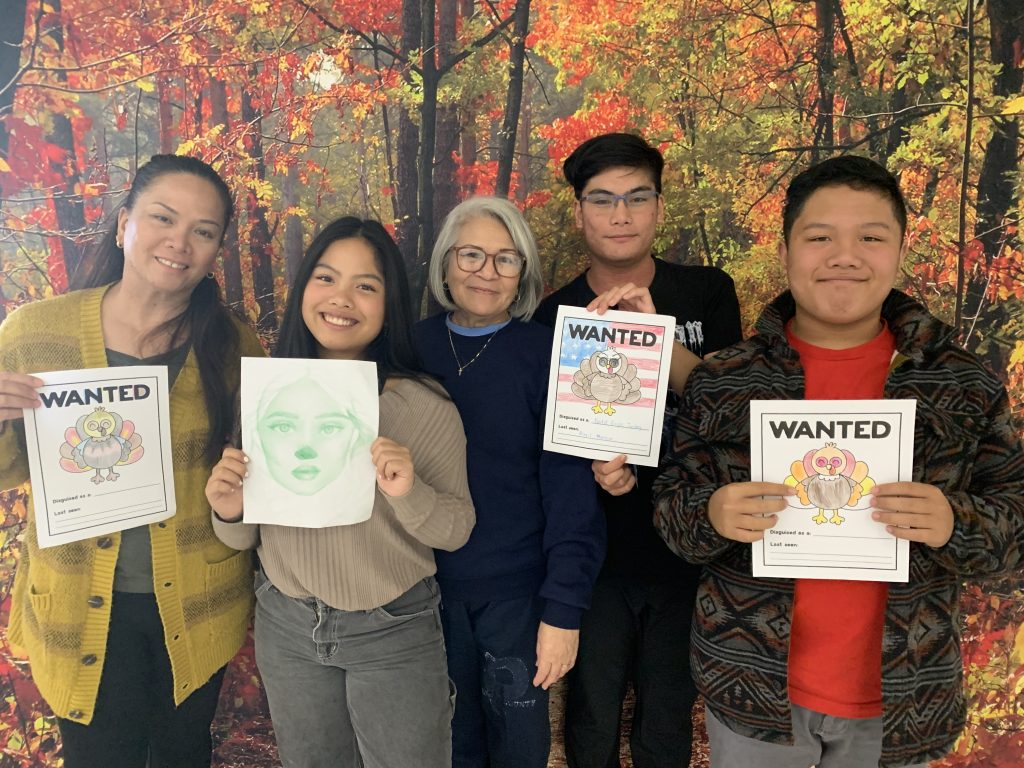 CIw Thanksgiving visiting event with a photo backdrop.