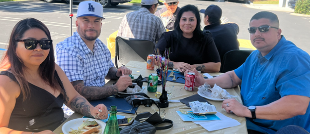 two former parolees eat lunch with their loved ones at the early discharge ceremony