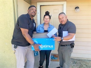 Two CDCR chaplains deliver a basket.