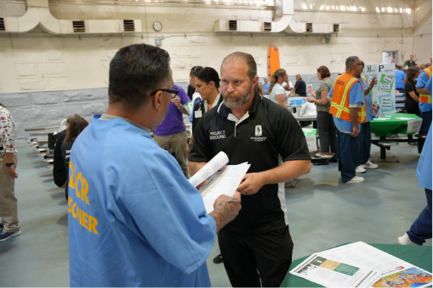 Sac St vendor speaking to incarcerated at FSP program fair