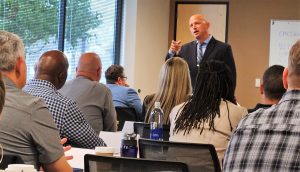 Healthcare corrections services speaks to students attending training.