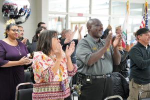 Ironwood State Prison staff and family members of the incarcerated graduates applaud their accomplishments.