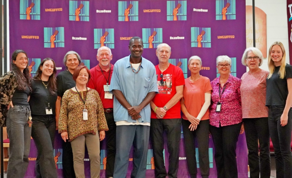 incarcerated standing with group at Uncuffed graduation
