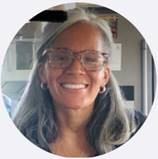 Jody De Souza, a retired correctional officer, smiling.