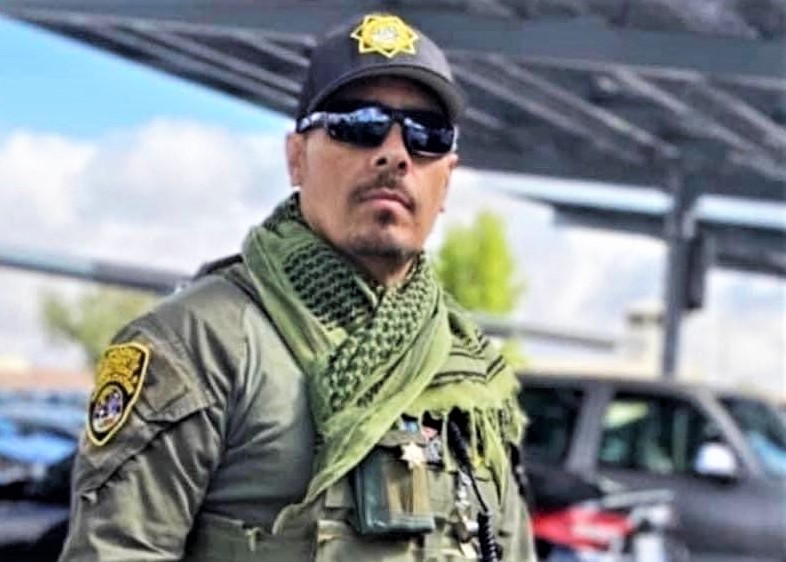 Roberto Hermosillo wearing a correctional officer uniform.