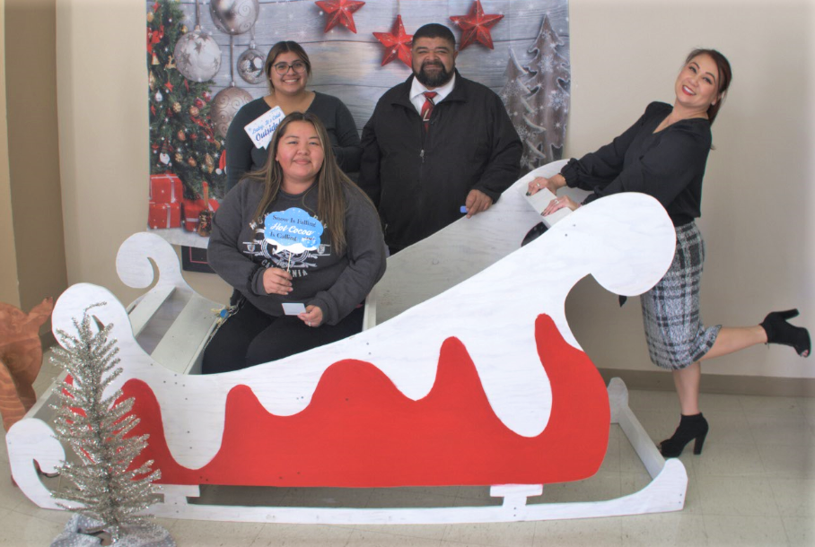 Staff appreciation event at a prison for the holidays with a sleigh and Christmas decorations.