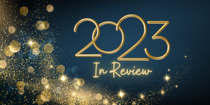 "2023 in review" in gold font on a blue background