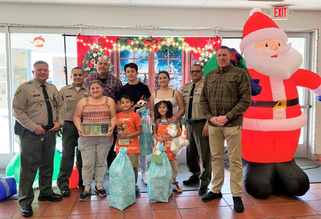Christmas gifts and a family with CDCR staff.