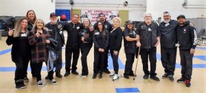 A group photo of people in the gymnasium at California Institution for Women.