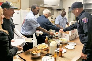 CMF staff serving incarcerated at pizza feed