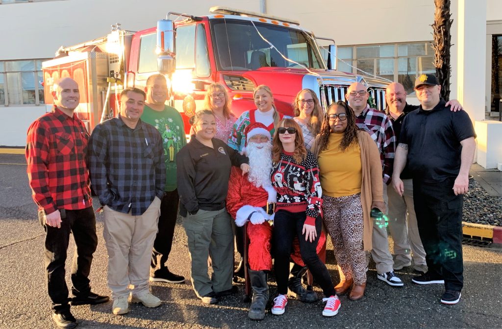 California Medical Facility with staff and Santa in front of a fire engine during a holidays events to show staff appreciation.