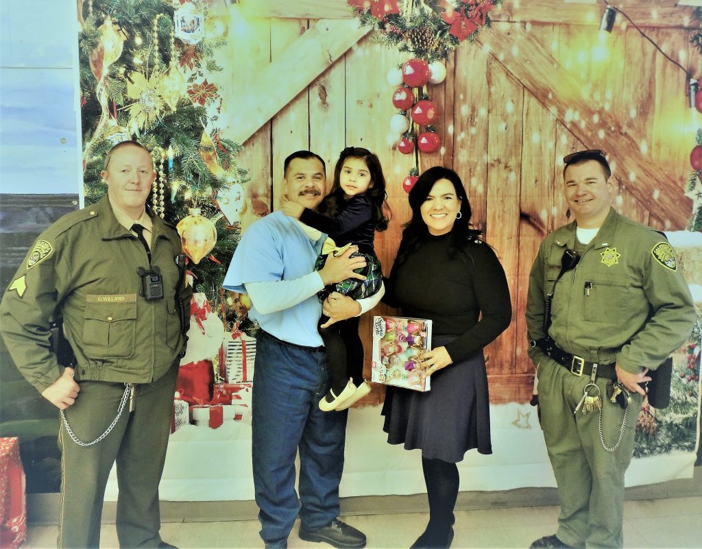 Prison staff, an incarcerated person and visitors.