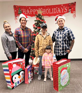 Parole agents and staff with a paroled parent and their child.