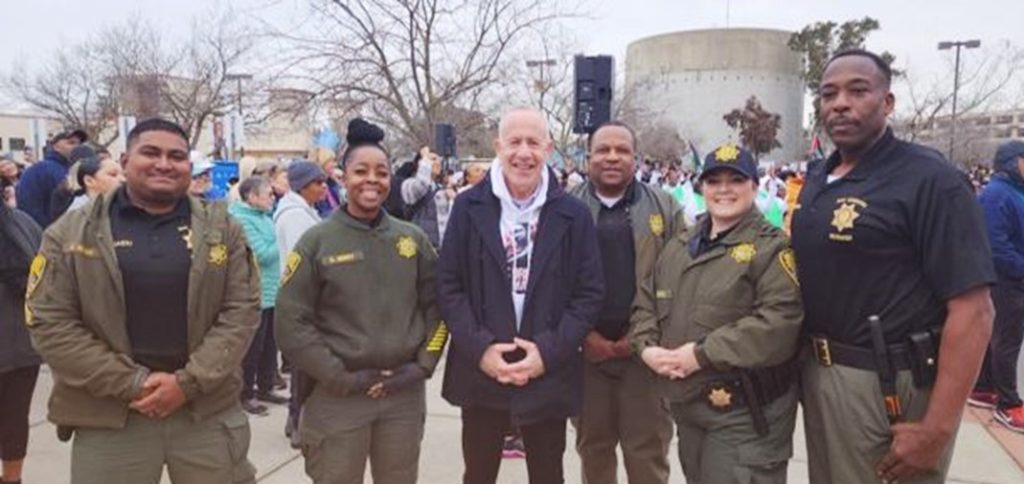 Correctional staff with the Sacramento mayor at an MLK Day event.