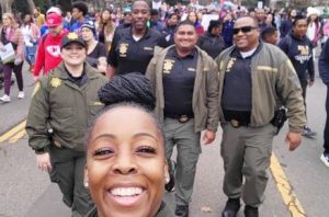 San Quentin recruiters walk in a Martin Luther King Jr. Day parade.