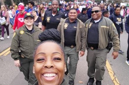 San Quentin recruiters walk in a Martin Luther King Jr. Day parade.