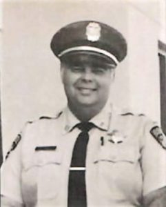Ted Pruitt wearing a correctional officer uniform.