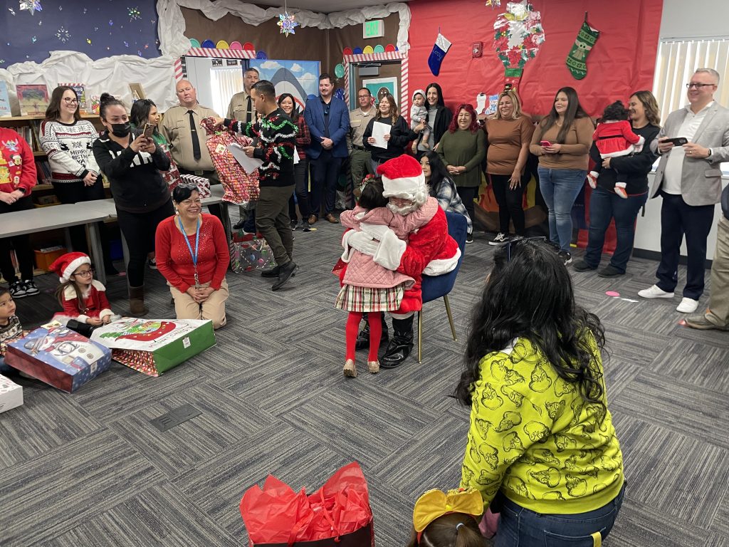 SATF Santa hugging child CDCR Christmas