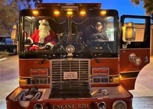 Fire engine with Santa and a fire captain.