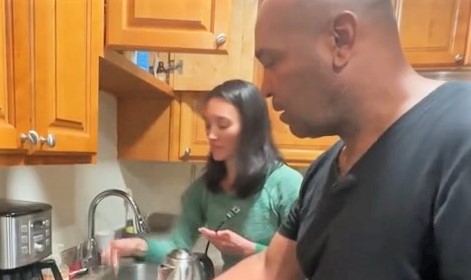 Week in Review re-entry story with two people standing in a kitchen.