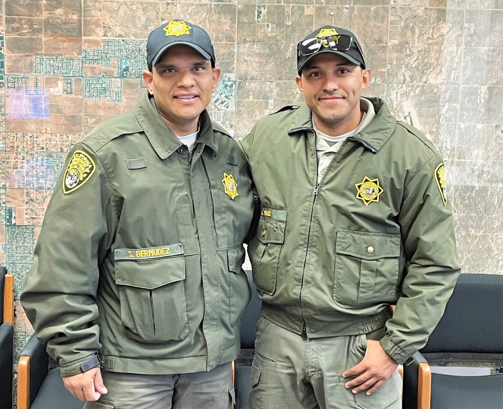 Two correctional employees pose for a photo as one is donating a kidney to the other.