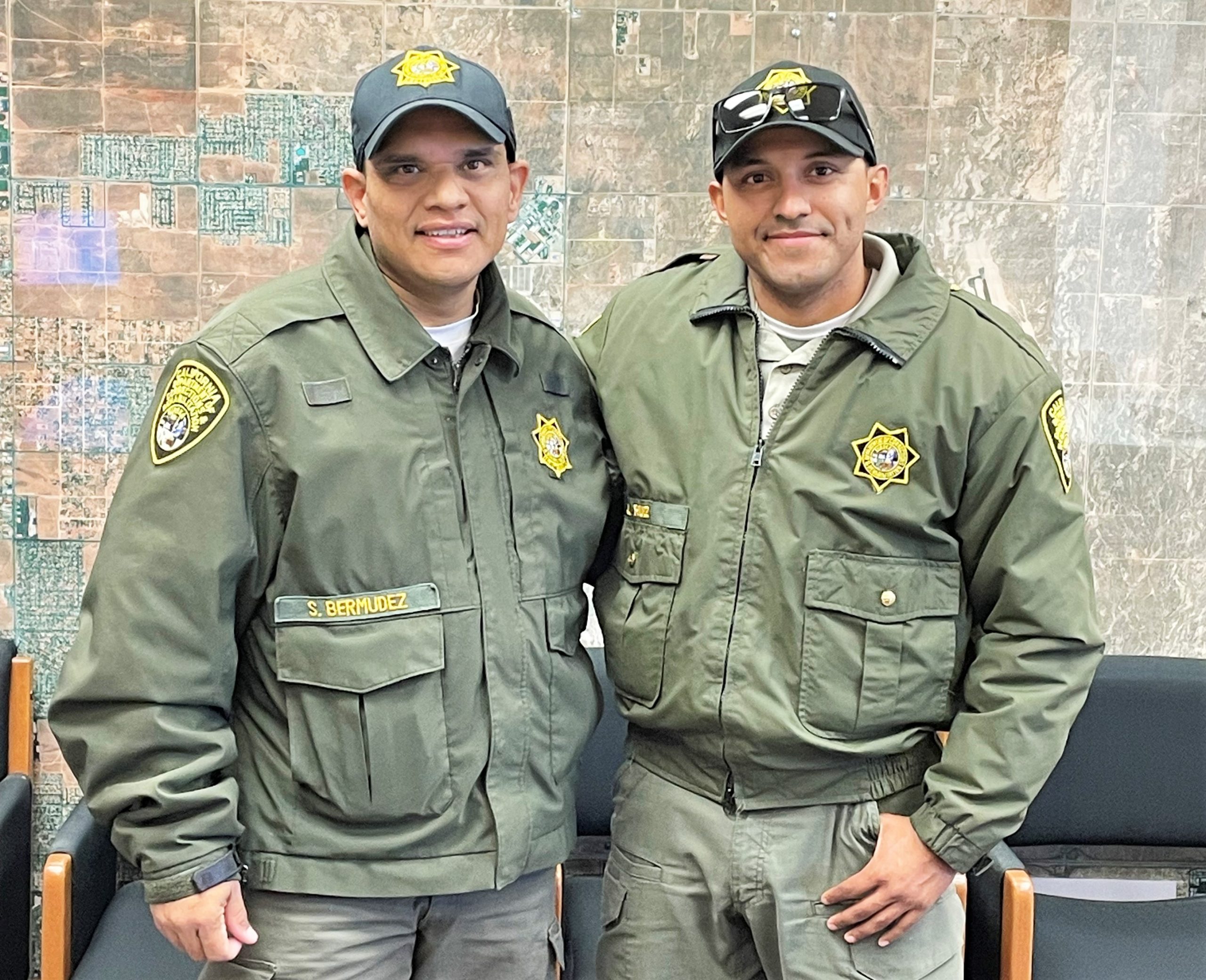 Two correctional employees pose for a photo as one is donating a kidney to the other.