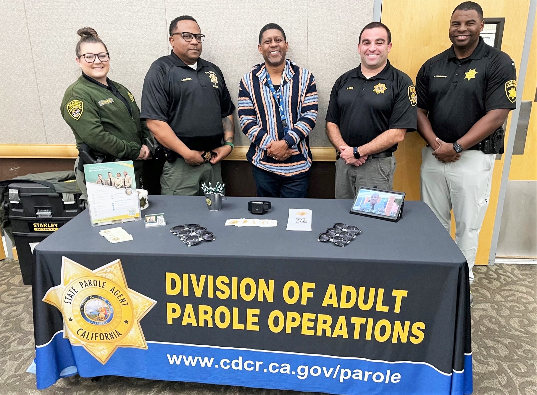 CDCR and parole recruiters at an information booth for a youth academy.