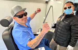 Removing gang tattoos at Avenal State Prison is a nurse. Her patient excitedly holds up his arms in gratitude.