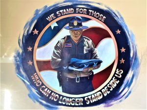 Officer Contreras mural with the words "we stand for those who can no longer stand before us."