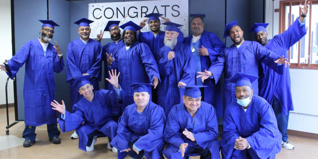Graduates wearing caps and gowns at Pelican Bay State Prison.