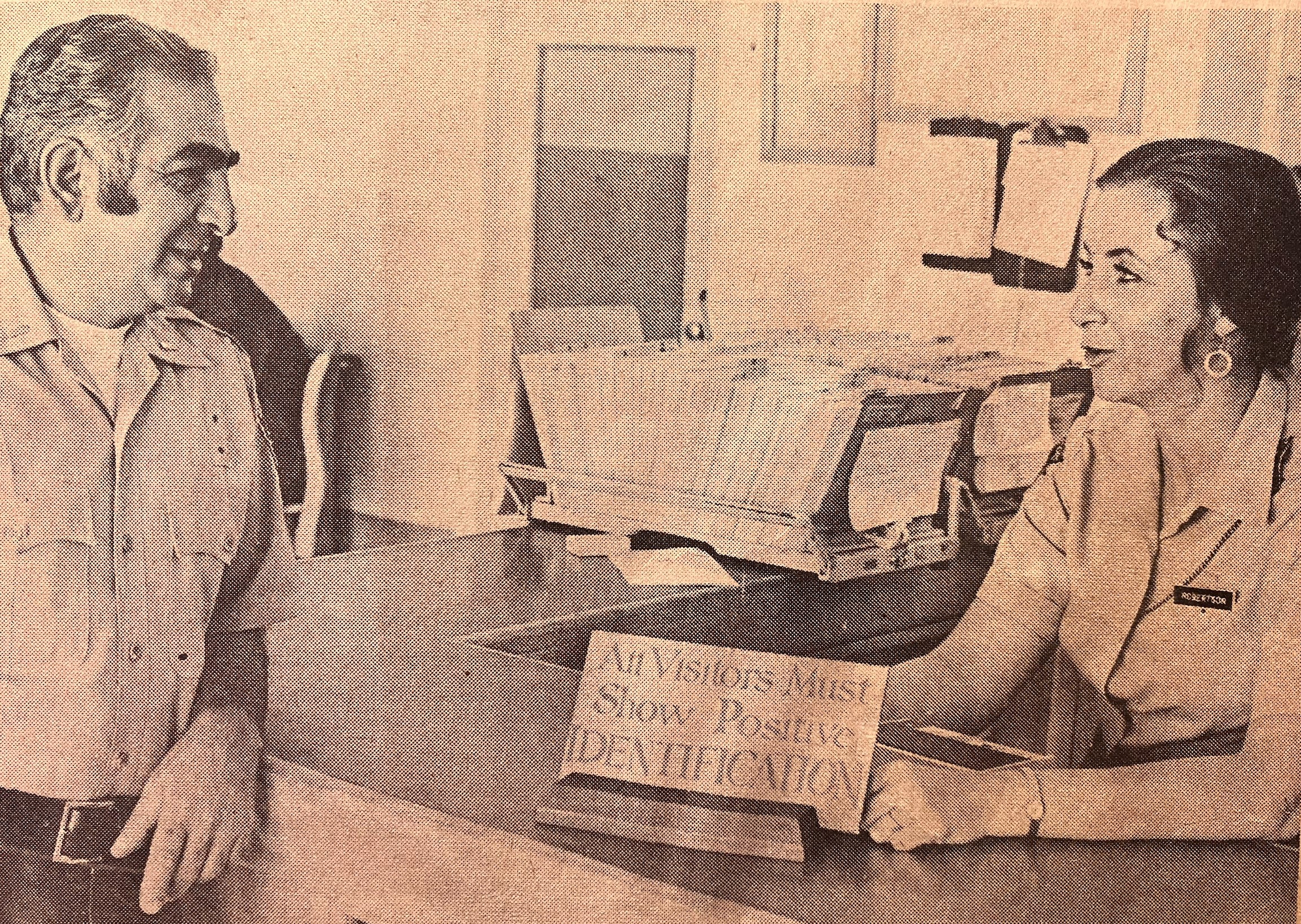 First woman correctional officer at Deuel Vocational Institution (DVI). She's seen here supervising the visiting room with a lieutenant.