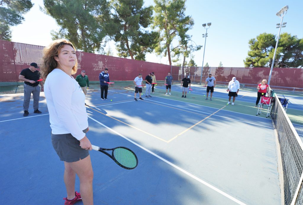 CDCR coaches professional development on a tennis court.