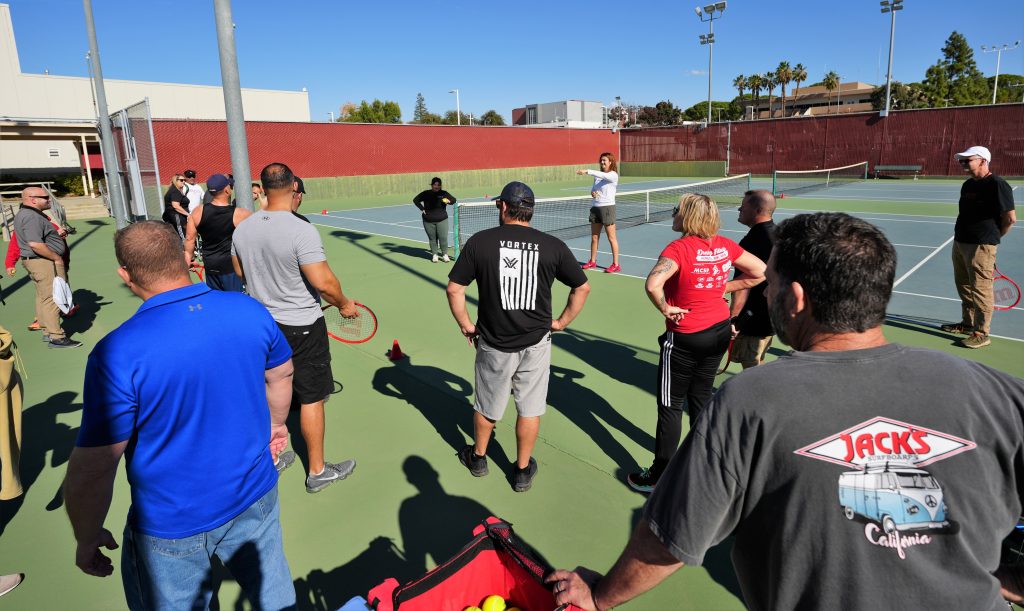 CDCR coaches on a tennis court.