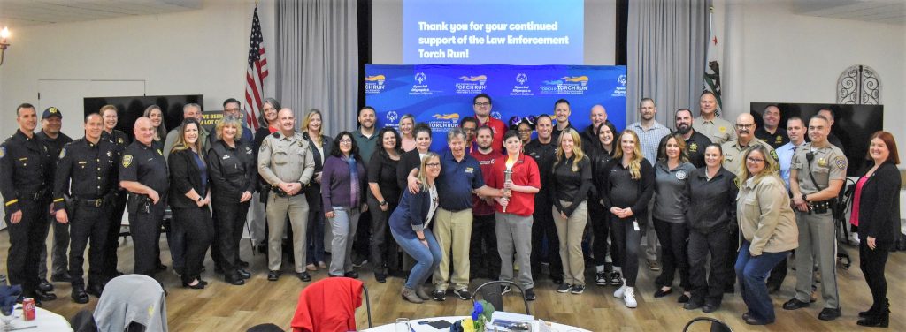 A group of law enforcement officials at a kickoff 2024 event for Special Olympics of Northern California.
