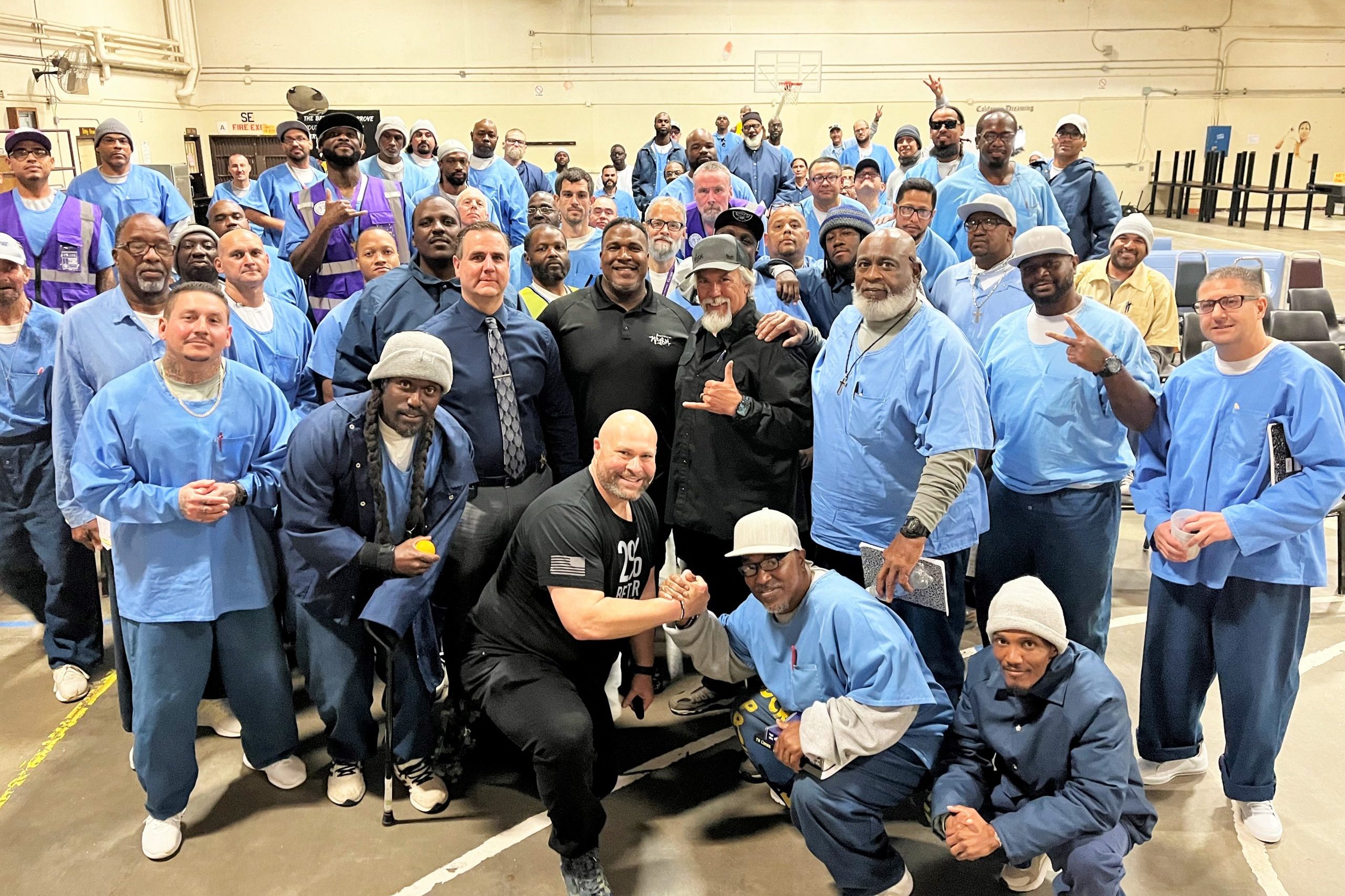 Staff and the population were offered special training to improve interactions within the Correctional Training Facility at Soledad. The photo shows mostly incarcerated people posing with a few staff members and the trainer.