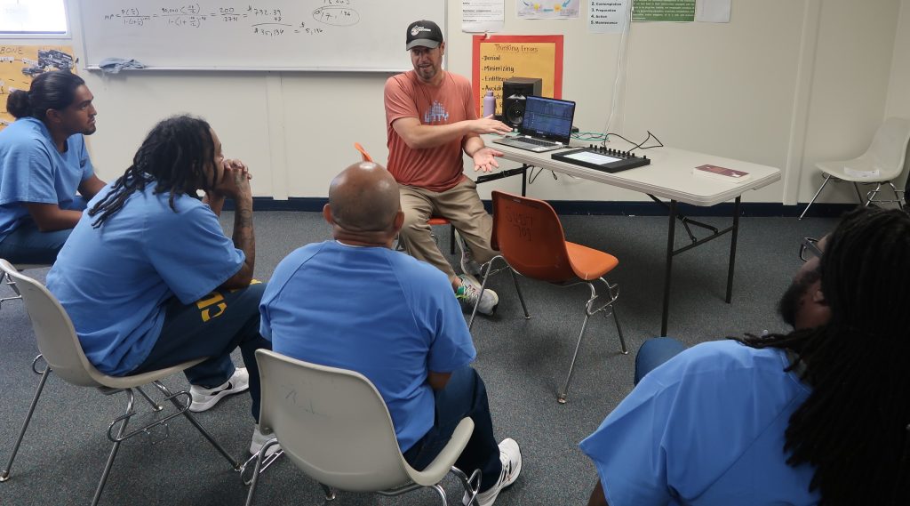 multiple incarcerated watching presentation