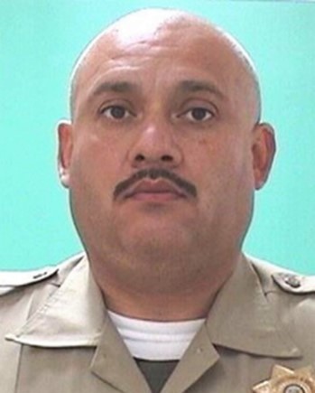 Jose Lopez wearing his correctional officer uniform.