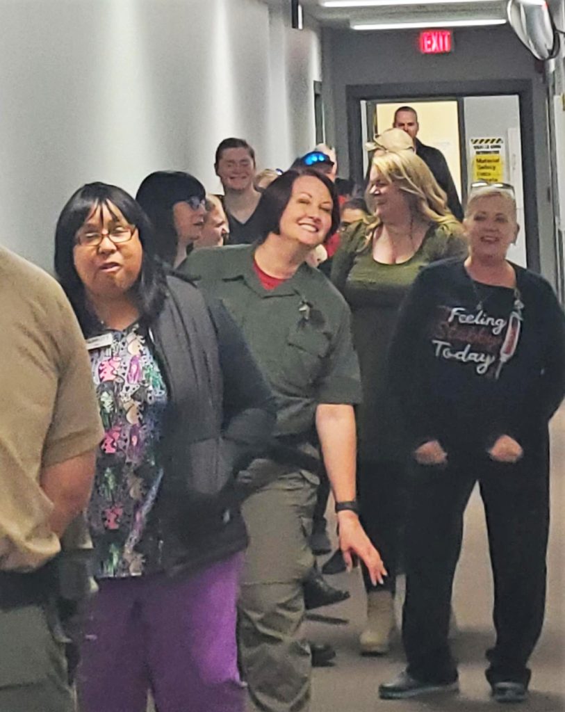 Staff wait in line for the International Women's Day event at Pelican Bay State Prison.