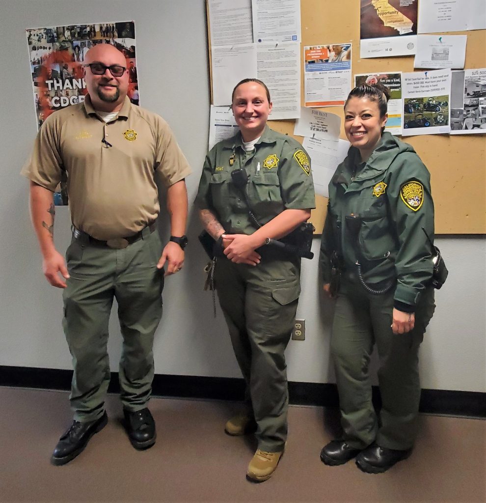Three staff members at International Women's Day at Pelican Bay State Prison.
