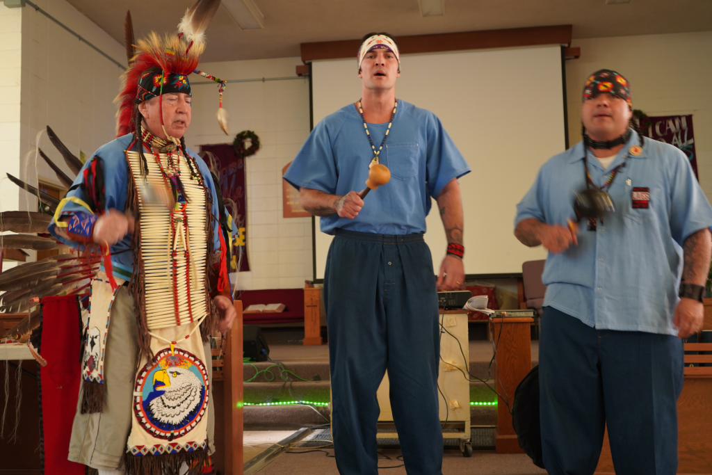 incarcerated members participating in Native American Powwow
