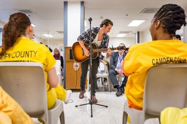 man with guitar performing