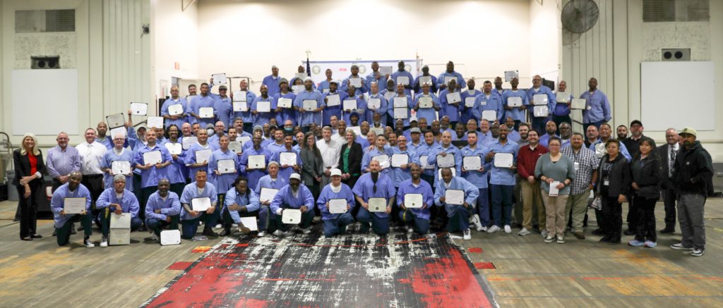 Group photo of 123 graduates at the Correctional Training Facility in Soledad.