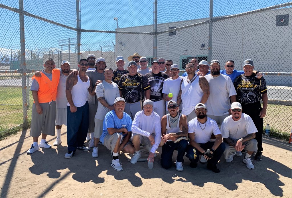 Centinela State Prison group photo of incarcerated people and volunteers at the Home Run Derby.