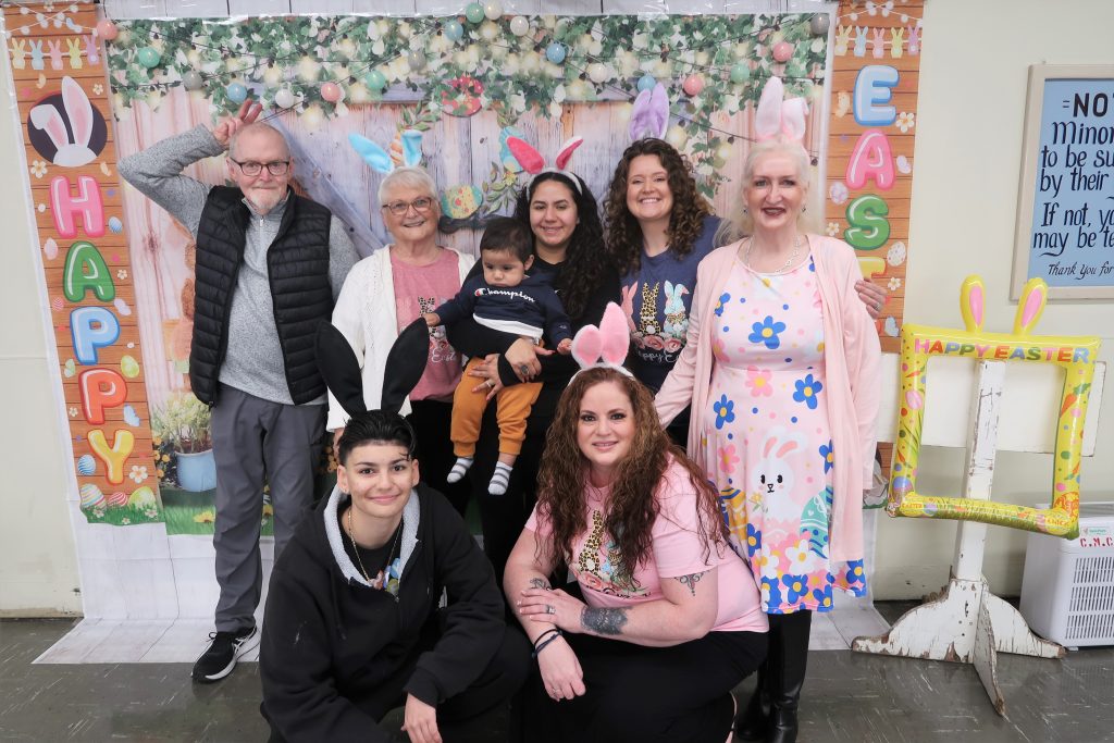 California Men's Colony family council posing for photos.